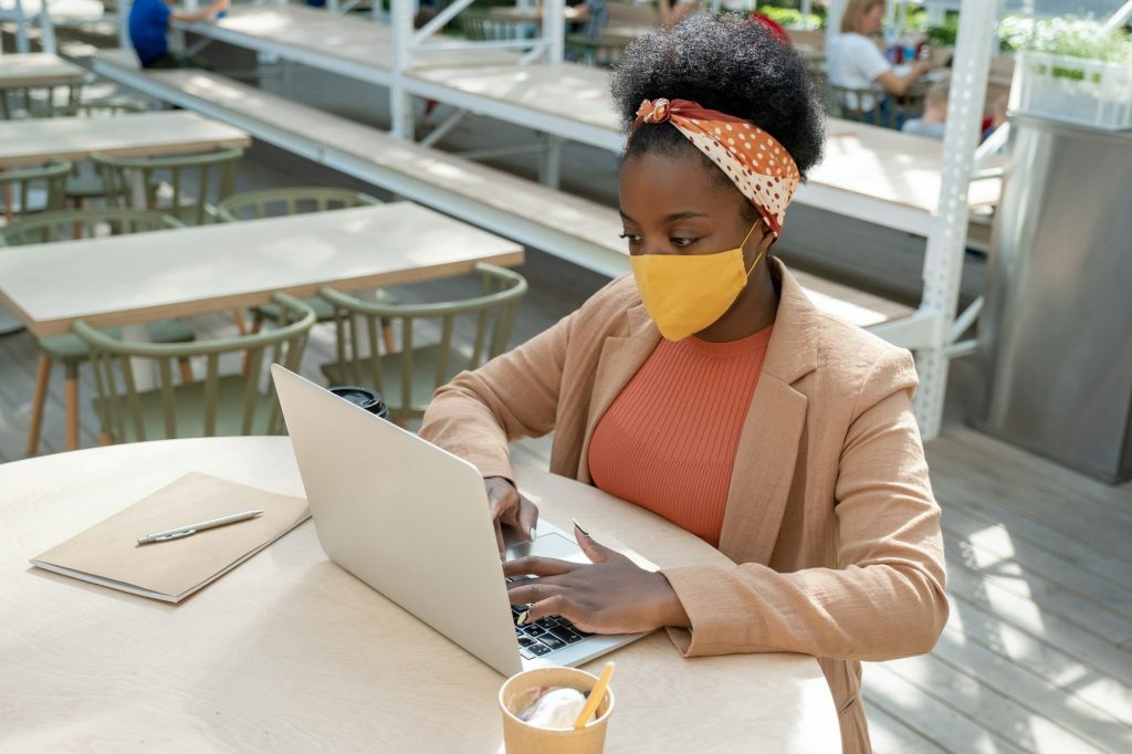 Businesswoman in cafe during pandemic